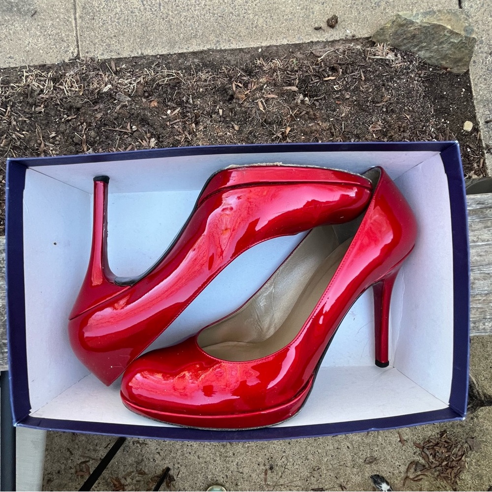 👠 Shiny red Stuart Weitzman sky-high heels!